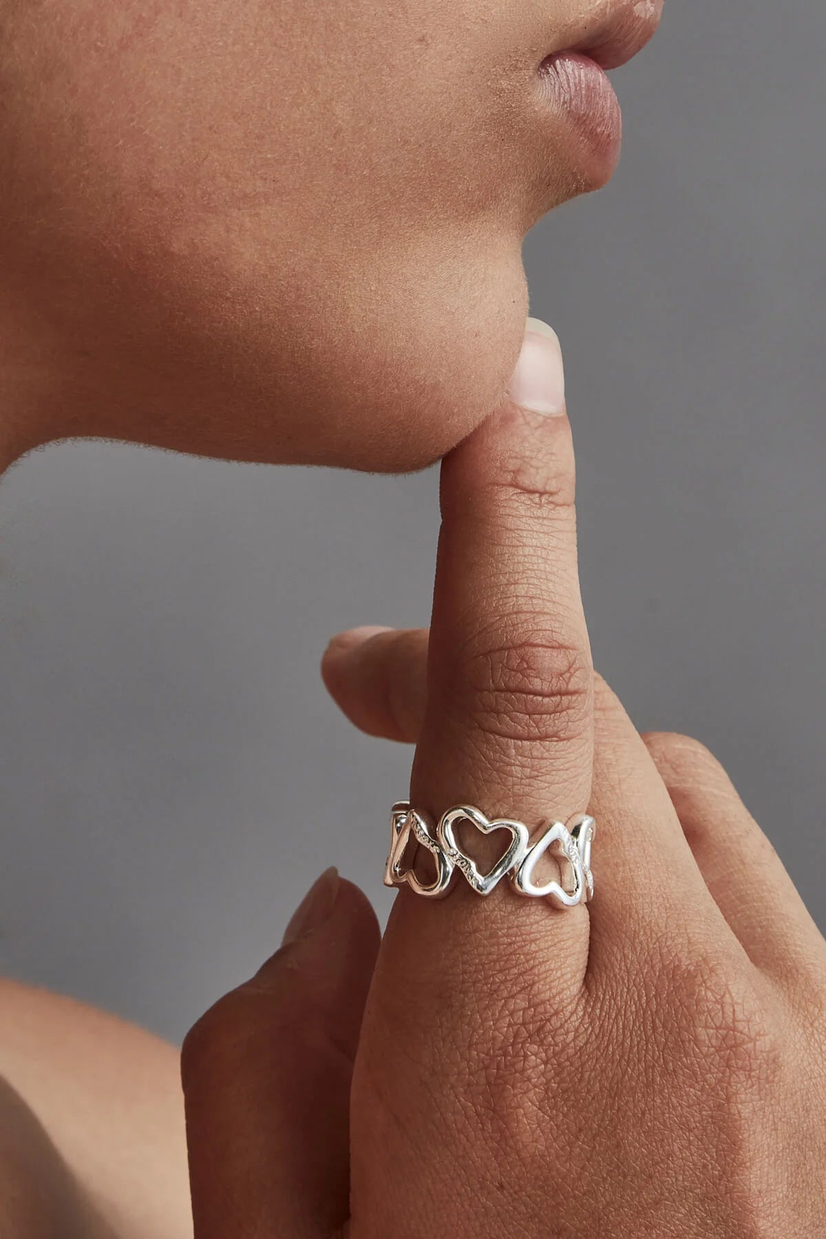 BAND OF MELTED HEARTS RING